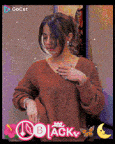a woman in a red sweater with the word black on the bottom