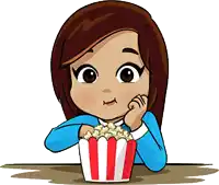 a girl is sitting at a table eating popcorn from a striped container
