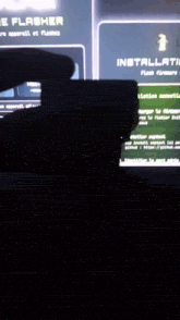 a person is holding a camera in front of a computer screen that says installation