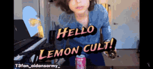 a person standing in front of a piano with the words hello lemon cult on the screen