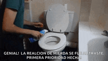 a man is cleaning a toilet with a toothpaste bottle .