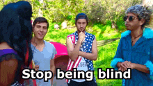 a group of people standing next to each other with the words " stop being blind " written on the bottom