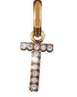 a gold pendant with the letter t surrounded by rhinestones