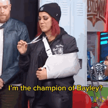 a woman with a broken arm in a cast says i 'm the champion of bayley