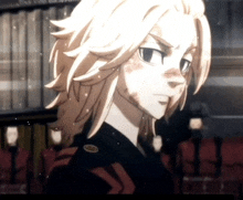 a close up of a person 's face with a badge that says ' tokyo ghoul ' on it .