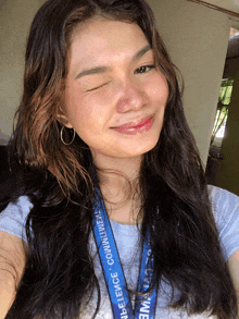 a woman with a lanyard around her neck that says silence communities