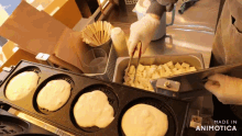 a person is making pancakes in a pan that says made in animotica on it