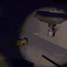 a dark room with a few lights on the walls