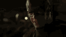 a blurry picture of a person 's face with lightning bolts coming out of it .