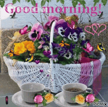 a basket of flowers and two cups of coffee on a table