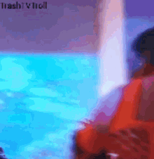 a blurry picture of a person in a pool with the words trashy troll visible