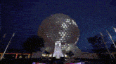 a large building with a fountain in front of it that says epcot