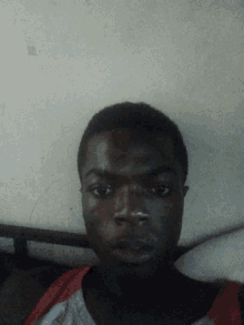 a close up of a man 's face with his eyes closed