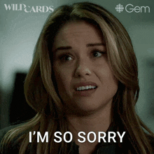 a woman says i 'm so sorry in front of a wildcards logo