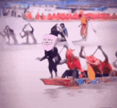 a group of people are rowing a boat with a pink face on the front of the boat