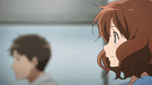 a girl with brown hair is looking at a man