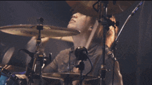 a person playing drums with a paiste cymbal