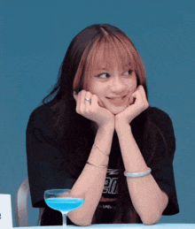 a girl wearing a black shirt that says ' 90 ' on it