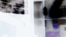 a blurry picture of a purple and white item