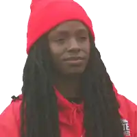 a woman wearing a red beanie and a red hoodie with the word te on the front
