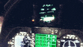 a cockpit of an airplane with a green display that says j.