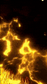 a dark background with a lot of yellow flames