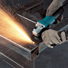 a makita grinder is being used to grind a piece of metal