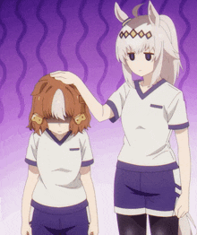a girl with white hair is touching another girl 's hair