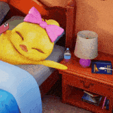 a cartoon duck with a pink bow is sleeping on a bed