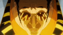 a man wearing sunglasses and a yellow and black striped shirt is looking at the camera .