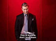 a man in a suit says " this is a plane and i love them "