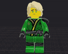 a lego figure with a green kimono and a yellow face