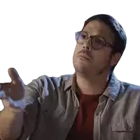 a man wearing glasses and a gray shirt is making a funny face