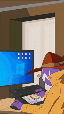 a man in a hat is using a tablet in front of a computer
