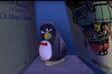 a stuffed penguin is sitting in front of a children 's book called little reader 's collection of children 's stories