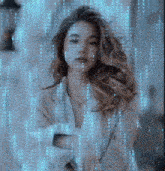 a woman is standing in front of a screen with numbers coming out of it