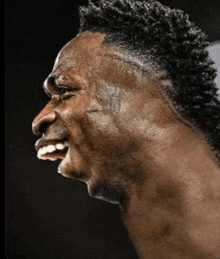 a close up of a man 's face and neck