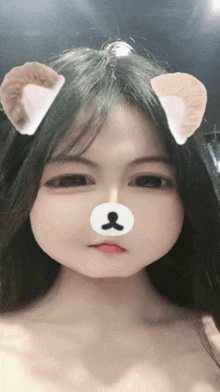 a young girl with a teddy bear face on her face