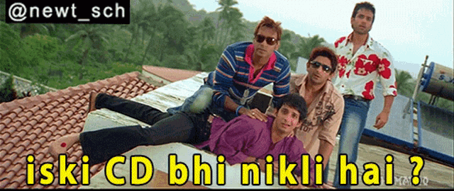 a group of men laying on top of a roof with the caption iski cd bhi nikli hai