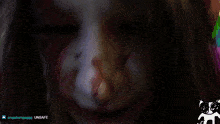 a close up of a person 's face with the words unsafe visible