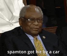 a man in a suit and tie with the words spamton got hit by a car above him