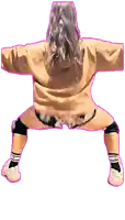 a woman wearing a hoodie and shorts is dancing
