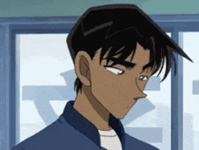 a man in a blue jacket and white shirt is looking down