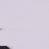 a close up of a woman 's face with a blurry background .