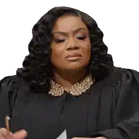 a woman in a black gown has a pen in her hand