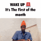 a man in a plaid shirt and tie is making a funny face while wearing an orange hat .
