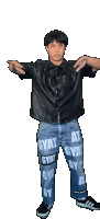 a man wearing a black shirt and blue jeans with gyat written on them
