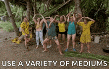 a group of people are dancing on a beach with the words use a variety of mediums