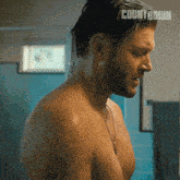 a shirtless man in a bathroom with the word countdown on the bottom right