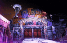 a purple sign that says welcome to the strip on it